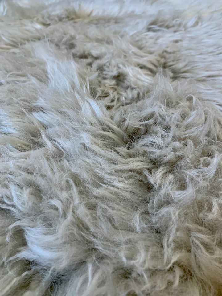 OTTOMAN ROUND TAUPE LAMBSKIN TOP (NRD)